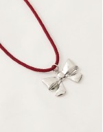 necklace with bow pendant on red cord