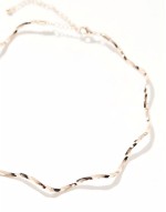 torque choker with wave design in gold tone