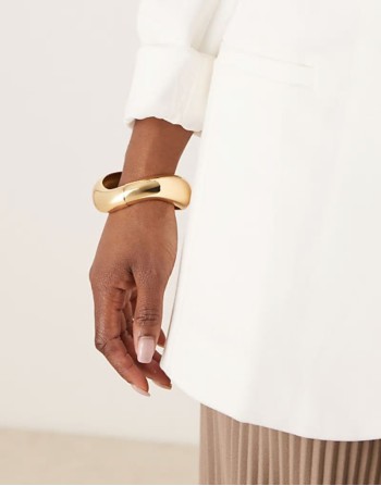 cuff bracelet with twist design in gold